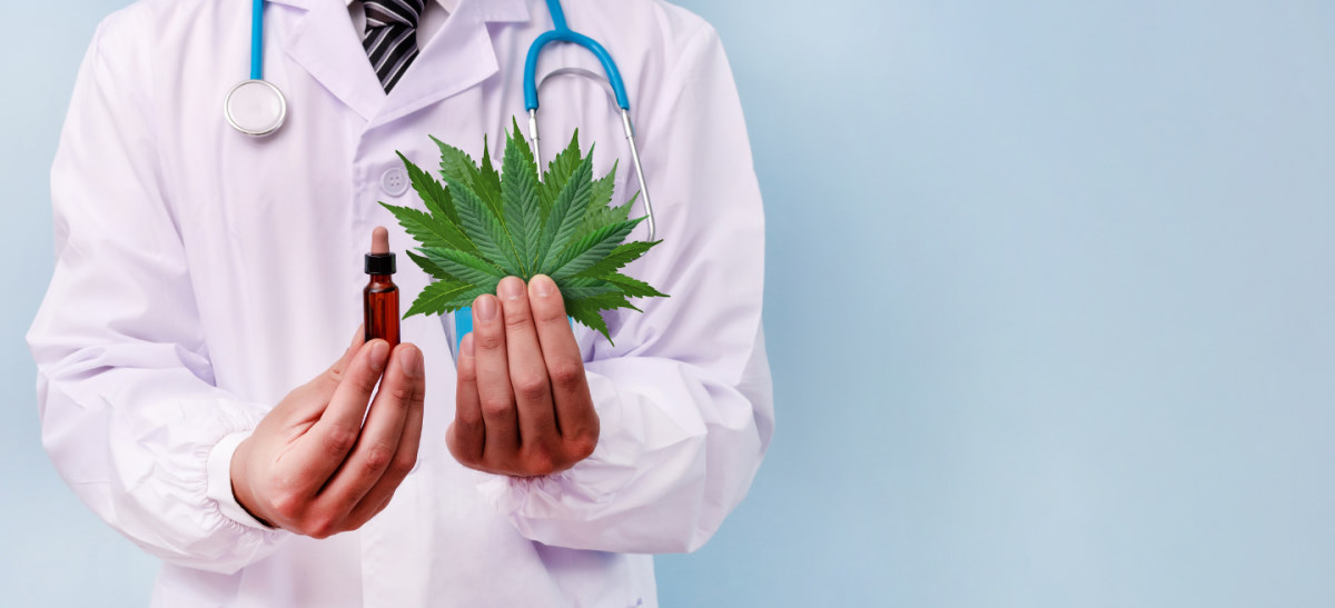 doctor with cannabis leaf and oil