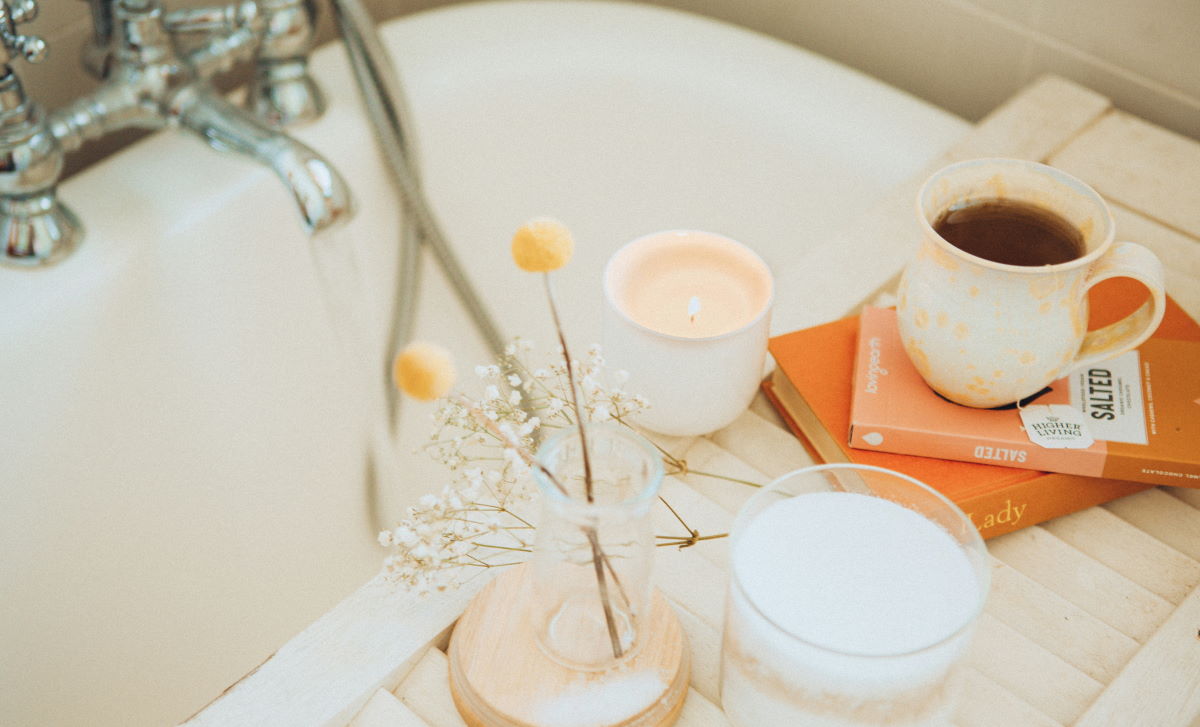 bath with hot drink and candle