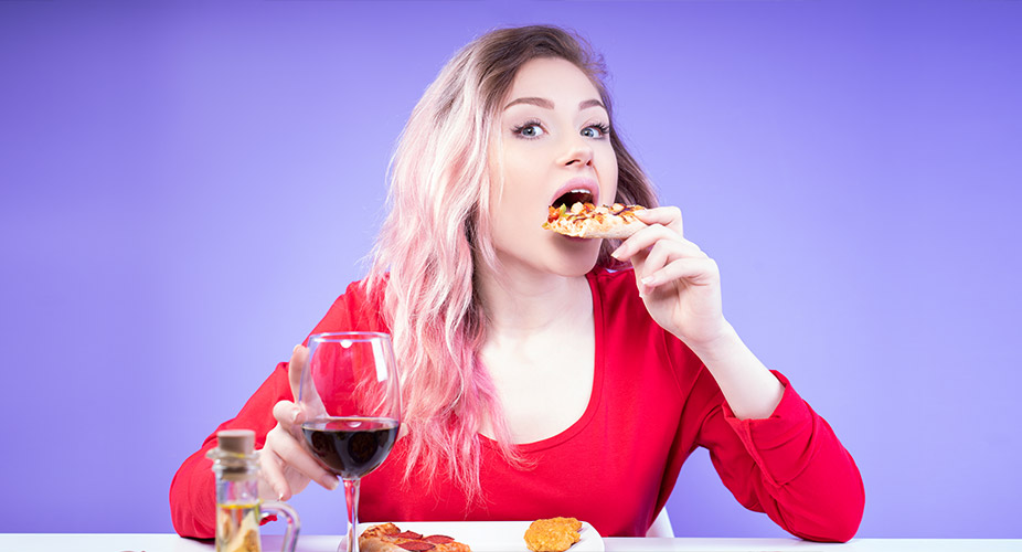 woman eating pizza