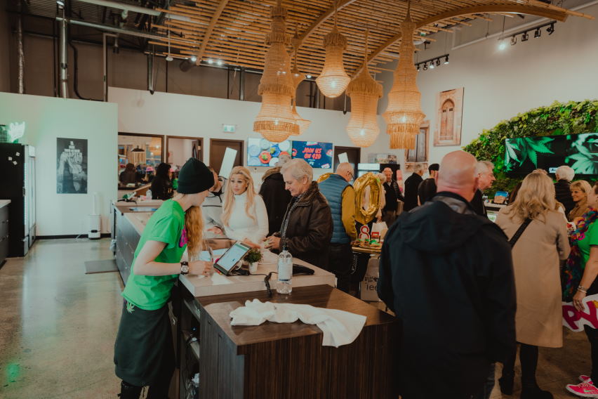 staff helping crowd of customers