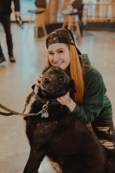 happy dog and staff