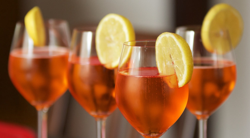 orange drinks with lemon garnish 