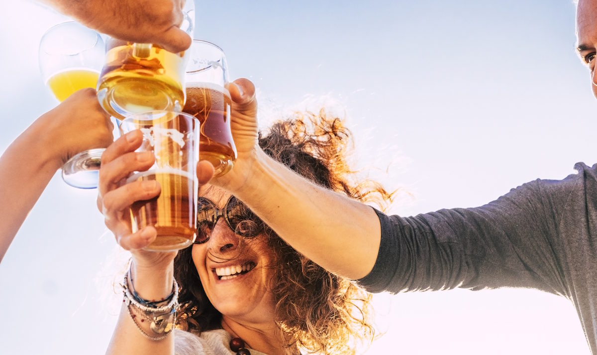 clinking glasses of beers