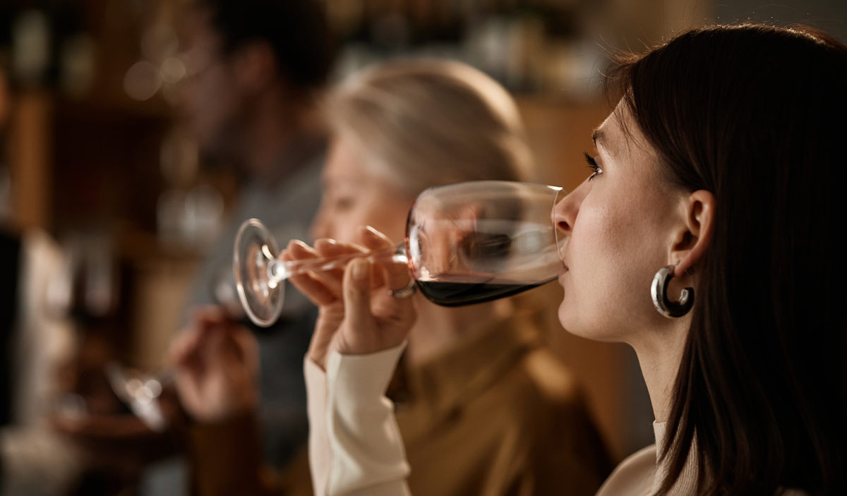 drinking a glass of wine