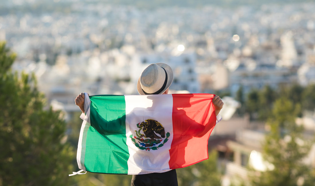 holding a Mexican flag